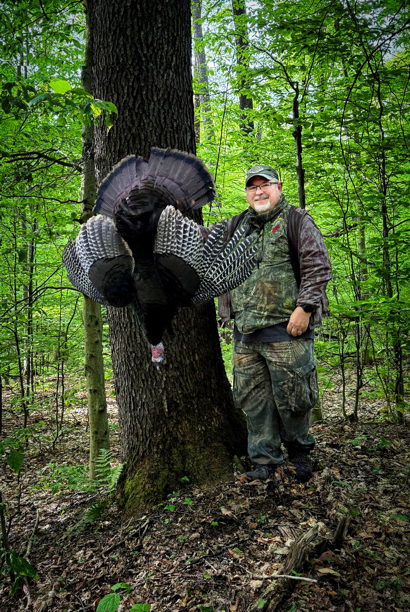 Mike Joyner holding up a turkey